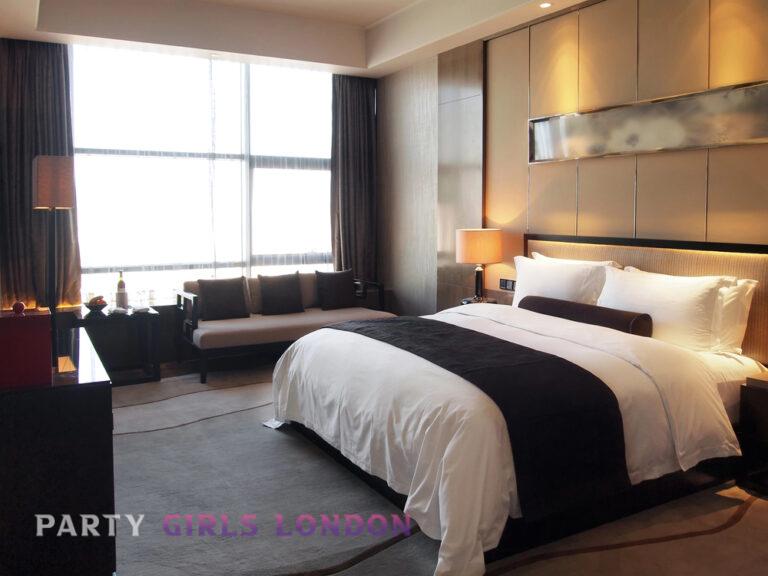 Discreet London hotel room prepared for a calm outcall evening with soft lighting and relaxed atmosphere