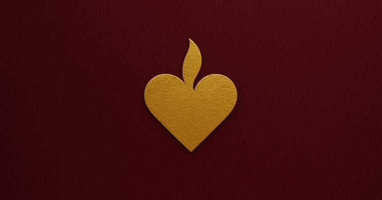Golden heart with flame symbol on burgundy background